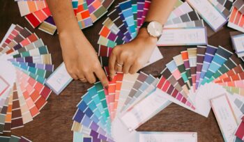 person holding white printer paper